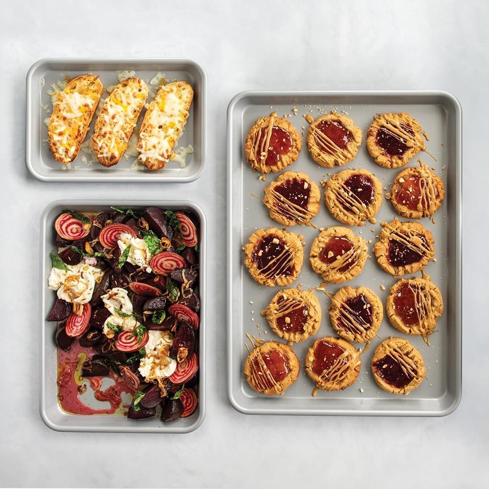 imageNordic Ware Brilliant Colorful Bakeware 12 Cavity Muffin Pan Nonstick made without PFAS or PTFE for safe cooking Reinforced steel rim prevents warping3pc Baking Sheet Set