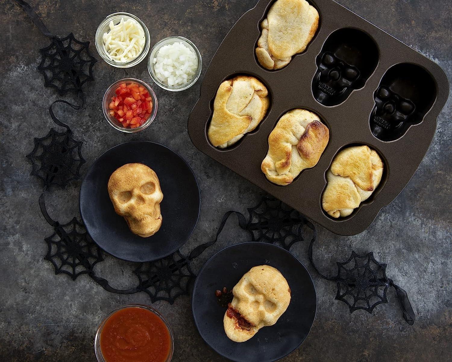 imageNordic Ware Halloween Bakeware Haunted Skull Cakelet Pan Bronze118 x 10 x 2 inches Pack of 3
