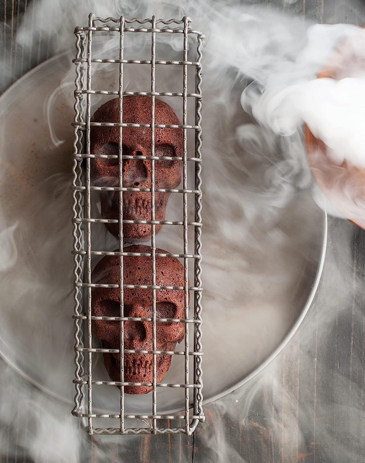 imageNordic Ware Halloween Bakeware Haunted Skull Cakelet Pan Bronze118 x 10 x 2 inches Pack of 3
