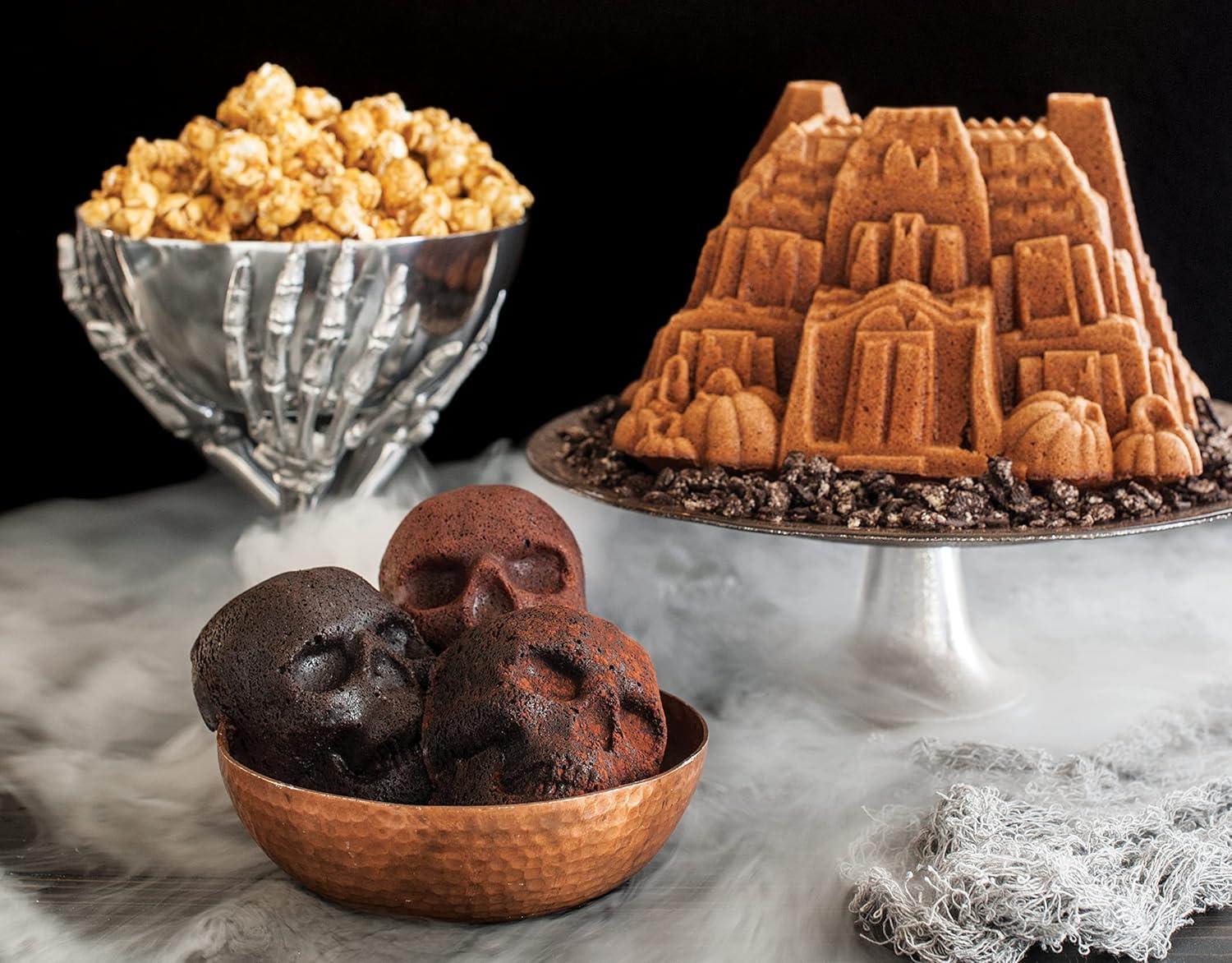 imageNordic Ware Halloween Bakeware Haunted Skull Cakelet Pan Bronze118 x 10 x 2 inches Pack of 3