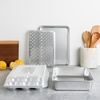 Nordic Ware Naturals 5-Piece Bake Set including Quarter Sheet, 9 x 13 Rectangular Pan, 12-Cup Muffin Pan, Multi-Task Oven & Cooling Rack, and a High Domed Lid